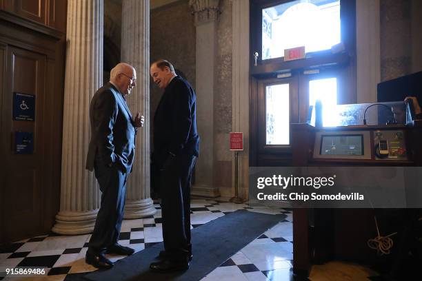 Sen. Patrick Leahy and Sen. Richard Shelby visit in the halls of the U.S. Captiol following a Republican caucus luncheon February 8, 2018 in...