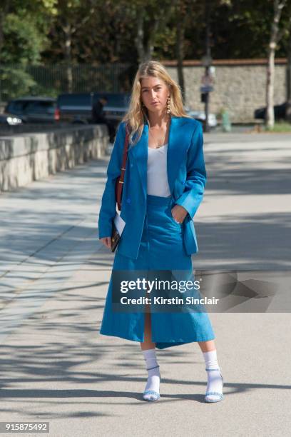 Fashion stylist at Eurowoman Magazine Emili Sindlev wears a Nina Ricci jacket and skirt, Tabitha Simmons shoes and Celine earrings day 4 of Paris...