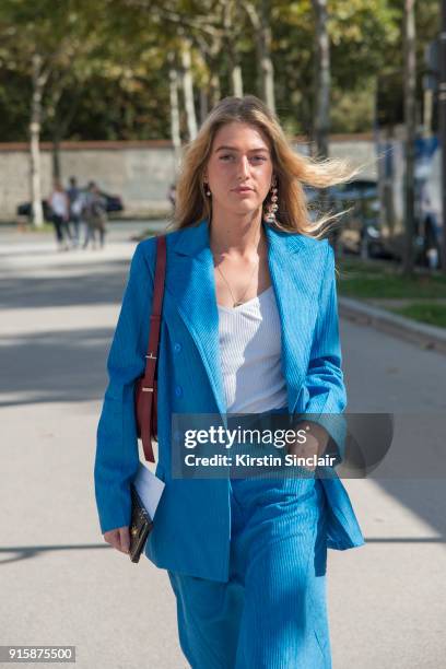 Fashion stylist at Eurowoman Magazine Emili Sindlev wears a Nina Ricci jacket and skirt and Celine earrings day 4 of Paris Womens Fashion Week...