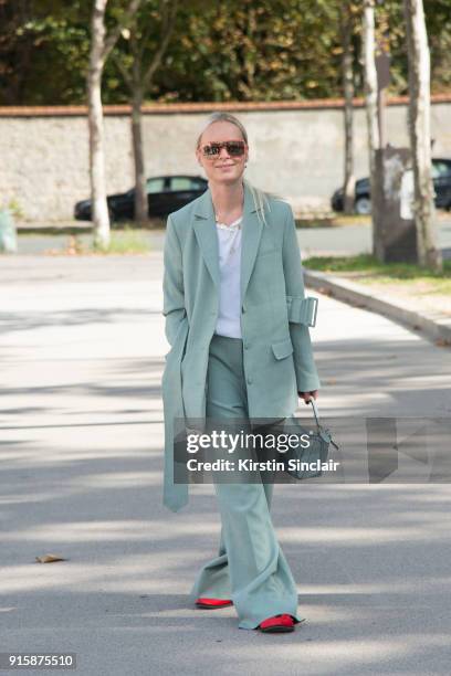 Fashion Director at Costume Magazine Denmark Thora Valdimars wears a Rodebjer suit, Loewe bag and Marc Jacobs sunglasses day 4 of Paris Womens...