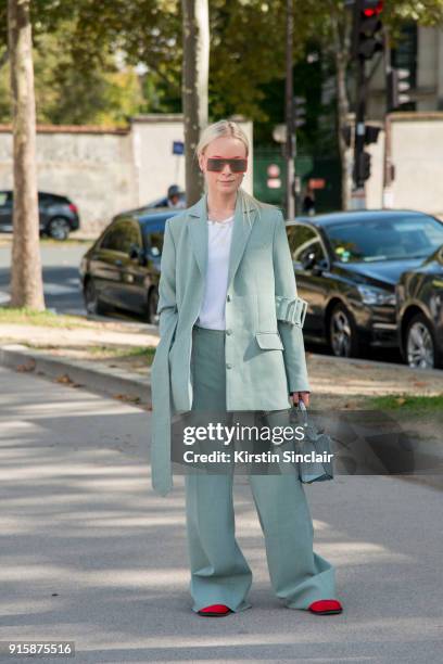 Fashion Director at Costume Magazine Denmark Thora Valdimars wears a Rodebjer suit, Loewe bag and Marc Jacobs sunglasses day 4 of Paris Womens...
