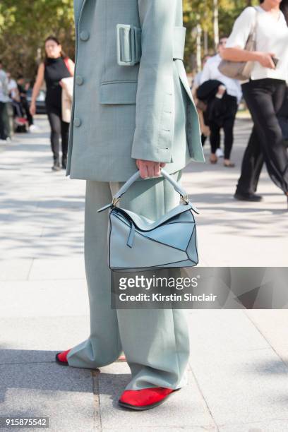 Fashion Director at Costume Magazine Denmark Thora Valdimars wears a Rodebjer suit and a Loewe bag day 4 of Paris Womens Fashion Week Spring/Summer...