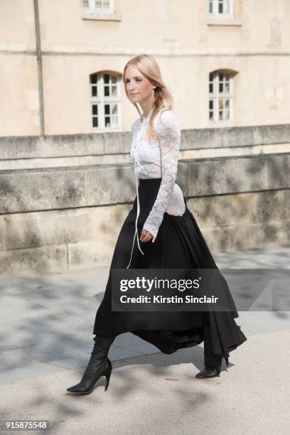 Fashion blogger Charlotte Groeneveld of The Fashion Guitar wears a Nina Ricci top, skirt and boots day 4 of Paris Womens Fashion Week Spring/Summer...