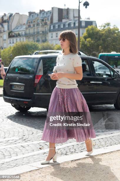 Fashion blogger Jenny Cipoletti wears a Tanya Taylor skirt and top, Valentino shoes and Oliver Peoples sunglasses day 4 of Paris Womens Fashion Week...