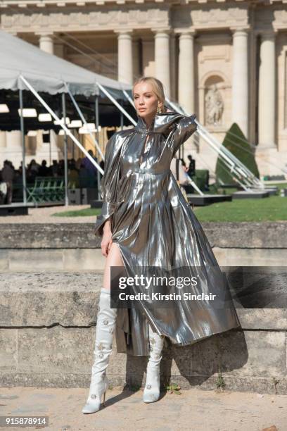 Model and Founder of Vaara active wear Tatiana Korsakova wears an Ellery dress, Altuzarra boots and a Loewe earring day 4 of Paris Womens Fashion...