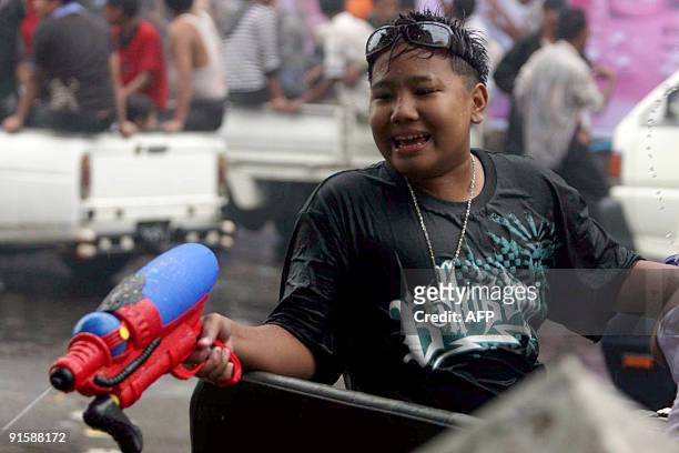 Myanmar youths celebrate the Songkran Festival in Yangon, on April 14, 2009. Thousands of partygoers took to the streets of Yangon to celebrate the...