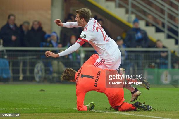Goalkeeper Michael Ratajczak of Paderborn and Thomas Mueller of Bayern Muenchen in action during the DFB Cup match between SC Paderborn and Bayern...