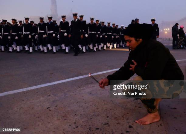 India's Border Security Force &quot;Daredevils&quot; women motorcycle rider lights an incense stick at Vijay Chowk as forces gather to rehearse for...