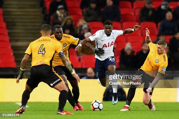 Scot Bennett, Frank Nouble and Joss Labadie of Newport County try and tackle Tottenham Hotspur's Serge Aurier during the FA Cup Fourth Round replay...