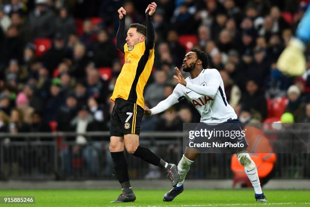 Tottenham Hotspur's Danny Rose gives Robbie Willmott of Newport County a little tug during the FA Cup Fourth Round replay match between Tottenham...