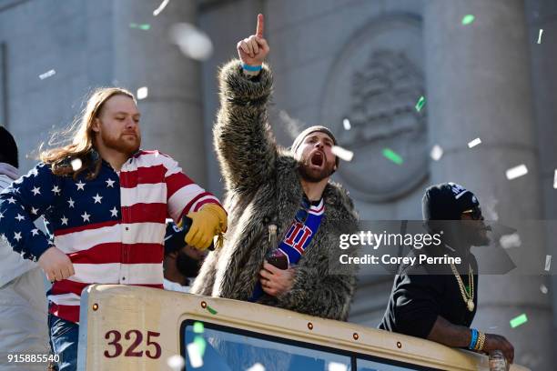 Chris Long lets out a yell on a parade vehicle next to Beau Allen of the Philadelphia Eagles during festivities on February 8, 2018 in Philadelphia,...