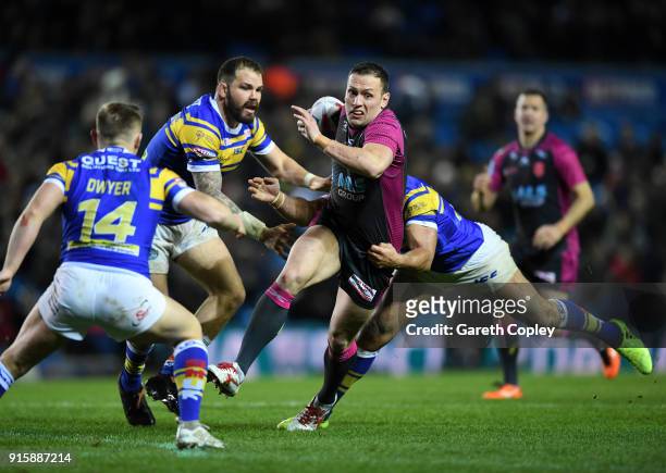 Shaun Lunt of Hull KR is tackled by Jamie Jone-Buchanan of Leeds Rhinos during the Betfred Super League match between Leeds Rhinos and Hull KR at...