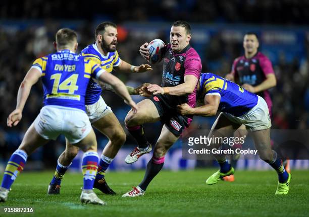 Shaun Lunt of Hull KR is tackled by Jamie Jone-Buchanan of Leeds Rhinos during the Betfred Super League match between Leeds Rhinos and Hull KR at...