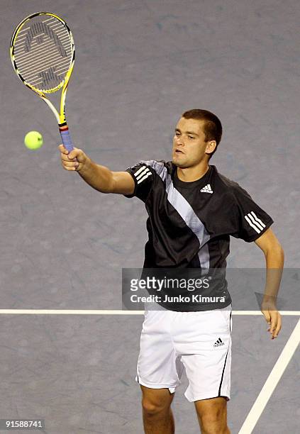 Mikhail Youzhny of Russia plays a forehand in his match against Gilles Simon of France during day four of the Rakuten Open Tennis tournament at...