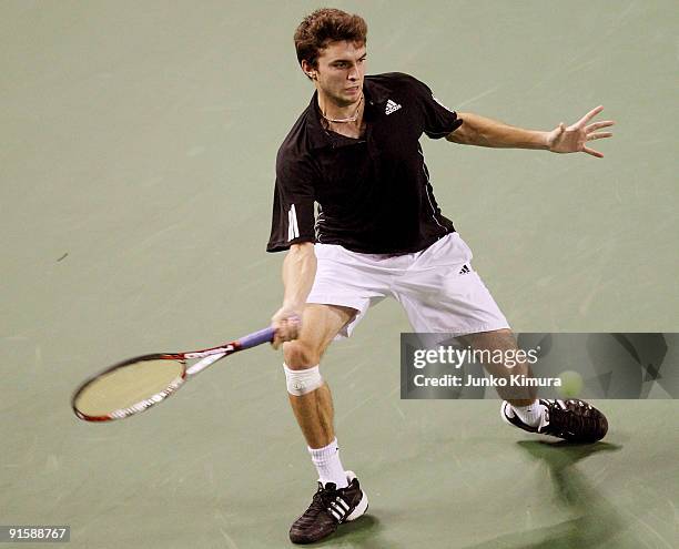 Gilles Simon of France plays a forehand in his match against Mikhail Youzhny of Russia during day four of the Rakuten Open Tennis tournament at...