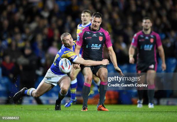 Danny McGuire of Hull KR is tackled by Jack Walker of Leeds Rhinos during the Betfred Super League match between Leeds Rhinos and Hull KR at Elland...