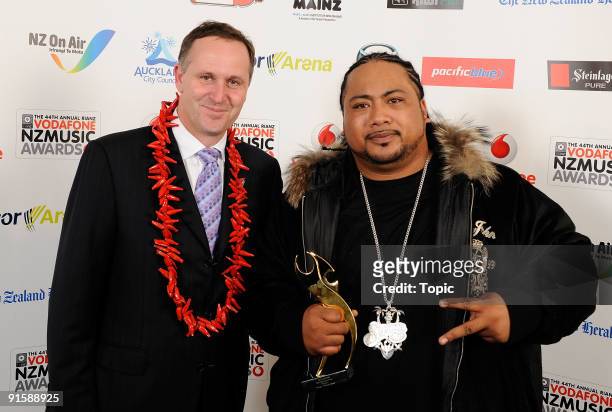 Prime Minister of New Zealand John Key and Savage pose during the 2009 Vodafone Music Awards at Vector Arena on October 8, 2009 in Auckland, New...