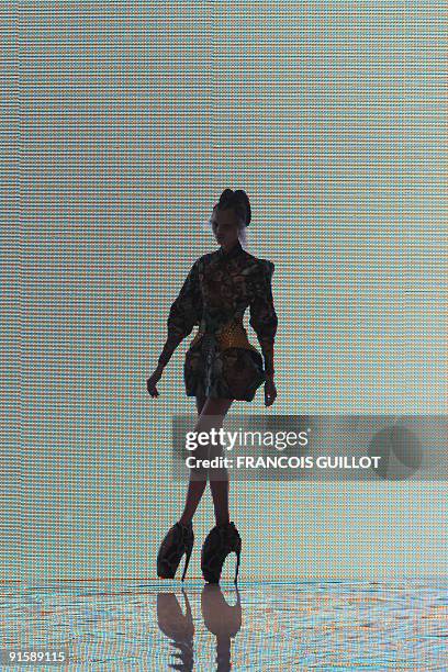 Model presents an outfit by British designer Alexander McQueen during ready-to-wear Spring-Summer 2010 fashion show on October 6, 2009 in Paris. AFP...