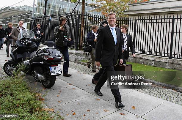 Guido Westerwelle, leader of the German Free Democrats walks after the second round of coalition negotiations between the FDP and the German...