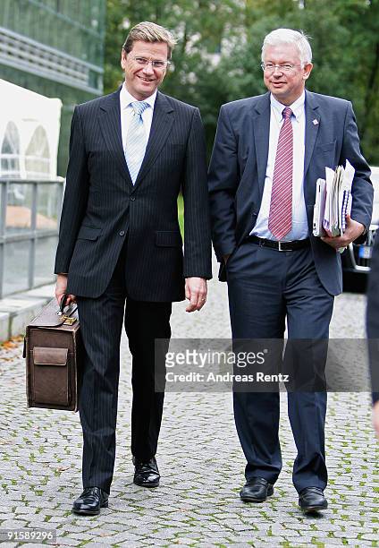 Guido Westerwelle , leader of the German Free Democrats and German Christian Democrat and Governor of the state of Hesse Roland Koch walk together...