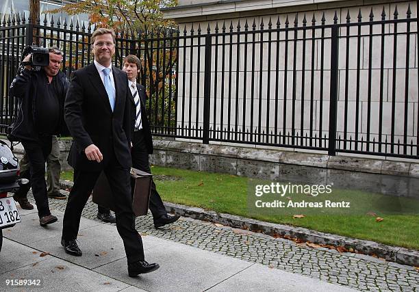 Guido Westerwelle, leader of the German Free Democrats walks after the second round of coalition negotiations between the FDP and the German...