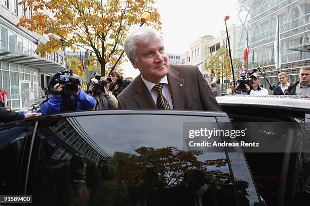 Leader of the Bavarian Christian Democrats Horst Seehofer stands next to a car after the second round of coalition negotiations between the German...