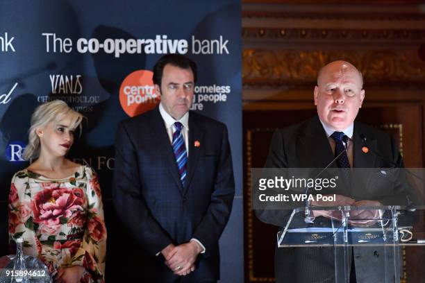 Actress Emilia Clarke, presenter Jonathan Ross look on as Actor Julian Fellowes speaks at the 2018 Centrepoint Awards at Kensington Palace on...