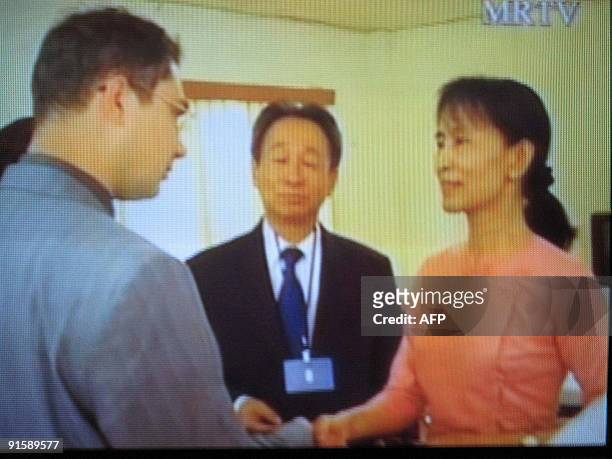 Television grab from MRTV shows Aung San Suu Kyi meeting with diplomats from Russia, Thailand and Singapore at the official guest house inside Insein...
