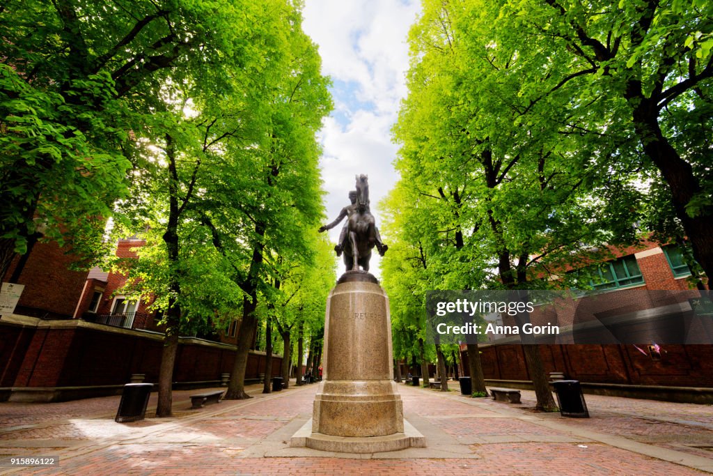 Statue of Paul Revere on horse in center of Paul Revere Mall leading to Old North Church along Freedom Trail, spring afternoon, Boston Massachusetts