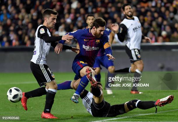 Valencia's Brazilian defender Gabriel Paulista vies with Barcelona's Argentinian forward Lionel Messi during the Spanish 'Copa del Rey' second leg...