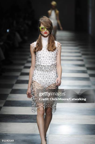 Model walks the runway during the Prada Spring Summer 2010 Ready To Wear show as part of the Milan Womenswear Fashion Week Spring/Summer 2010 at...