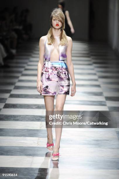 Model walks the runway during the Prada Spring Summer 2010 Ready To Wear show as part of the Milan Womenswear Fashion Week Spring/Summer 2010 at...