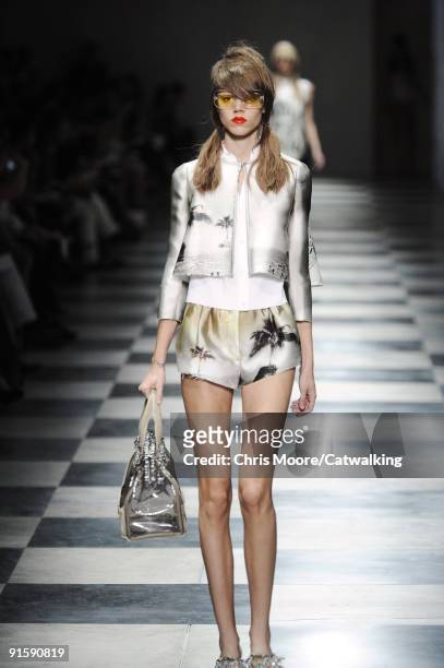 Model walks the runway during the Prada Spring Summer 2010 Ready To Wear show as part of the Milan Womenswear Fashion Week Spring/Summer 2010 at...