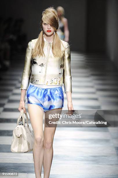 Model walks the runway during the Prada Spring Summer 2010 Ready To Wear show as part of the Milan Womenswear Fashion Week Spring/Summer 2010 at...