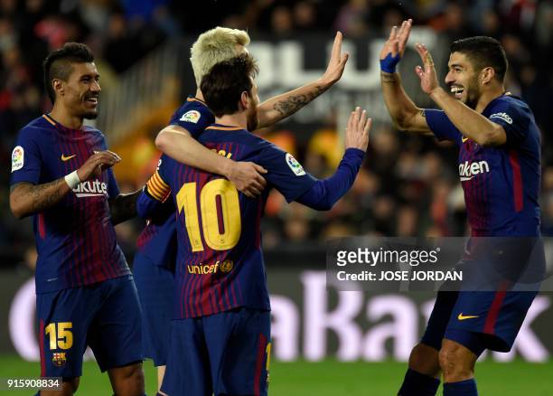 Barcelona's Croatian midfielder Ivan Rakitic celebrates a goal with Barcelona's Brazilian midfielder Paulinho , Barcelona's Argentinian forward...