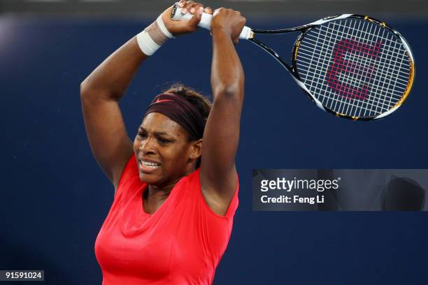 Serena Williams of USA misses a shot against Nadia Petrova of Russia in her third round match during day seven of the 2009 China Open at the National...