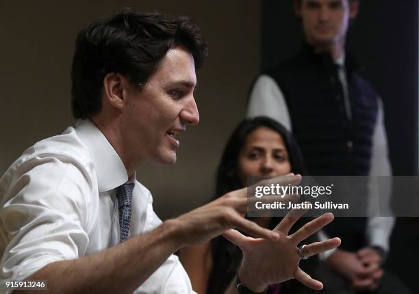 Canada Prime Minister Justin Trudeau talks with employees at AppDirect during a visit to the company on February 8, 2018 in San Francisco,...