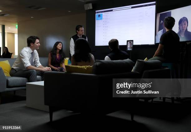 Canada Prime Minister Justin Trudeau talks with employees at AppDirect during a visit to the company on February 8, 2018 in San Francisco,...