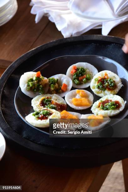 bánh bèo, vietnamese savory rice tea cakes topped with chicken and scallops - nha trang stock pictures, royalty-free photos & images