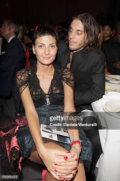 Giovanna Battaglia and Vladimir Restoin Roitfeld attend amfAR Milano 2009 Dinner, the Inaugural Milan Fashion Week event at La Permanente on...
