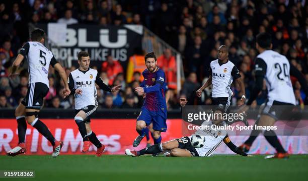 Lionel Messi of Barcelona surrounded by players of Valencia during the Semi Final Second Leg match of the Copa del Rey between Valencia CF and FC...