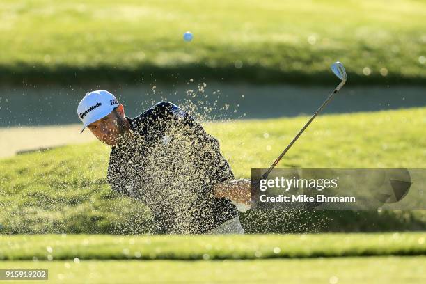 Dustin Johnson plays his shot from the bunker on the first hole during Round One of the AT&T Pebble Beach Pro-Am at Spyglass Hill Golf Course on...