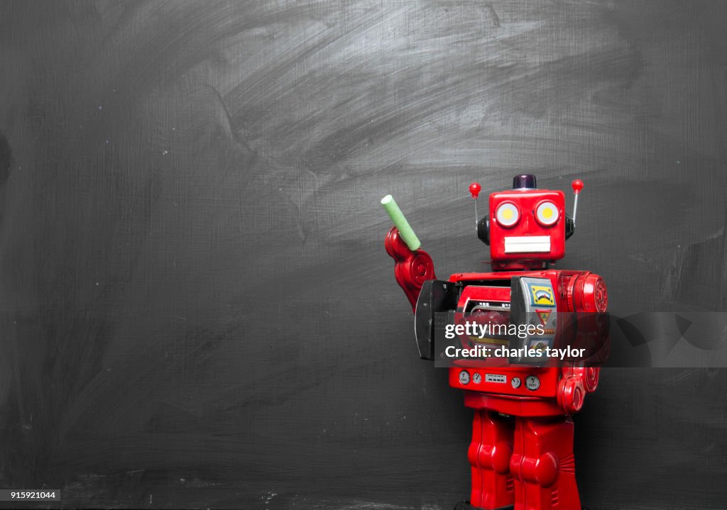Big red robot toy teaches his class ,