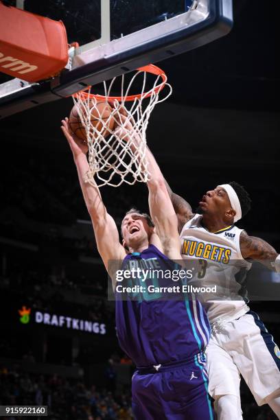 Cody Zeller of the Charlotte Hornets shoots the ball on Torrey Craig of the Denver Nuggets during the game between the two teams on February 5, 2018...