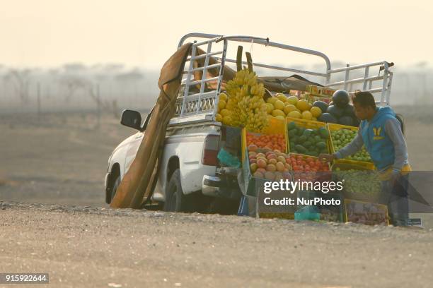 Man selling fruits and vegetable off his track alongside the road to Fujairah. On Thursday, February 8 in Fujairah, Fujairah Emirate, United Arab...