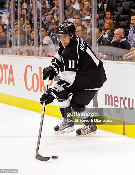 Anze Kopitar of the Los Angeles Kings handles the puck against the San Jose Sharks during the NHL hockey game on October 6, 2009 in Los Angeles,...