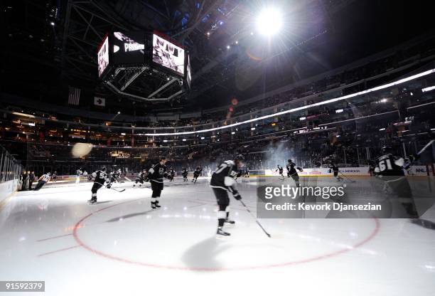 Los Angeles Kings skaters hit the ice against San Jose Sharks before the start of their NHL hockey game on October 6, 2009 in Los Angeles, California.