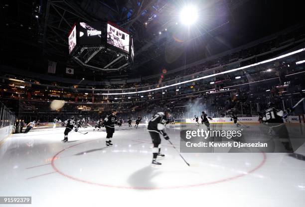 Los Angeles Kings skaters hit the ice against San Jose Sharks before the start of their NHL hockey game on October 6, 2009 in Los Angeles, California.