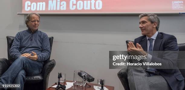 Mozambican writer Antonio Emlio Leite Couto , better known as Mia Couto, and the president of Camoes Institute Luis Faro Ramos applaud at the end of...