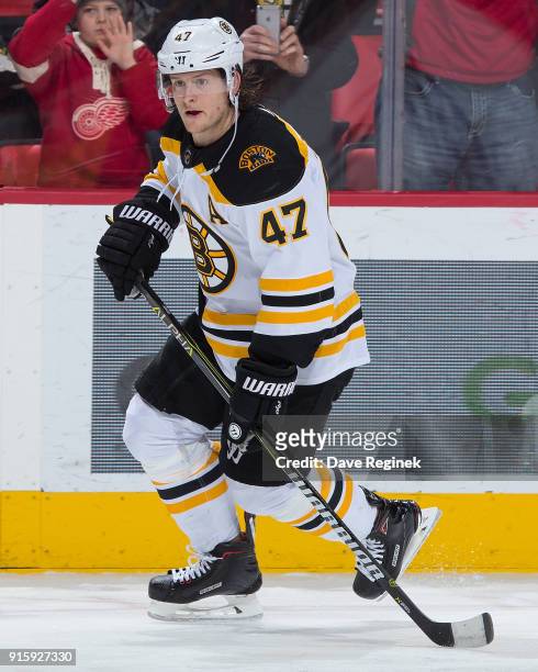 Torey Krug of the Boston Bruins skates in warm-ups prior to an NHL game against the Detroit Red Wings at Little Caesars Arena on February 6, 2018 in...